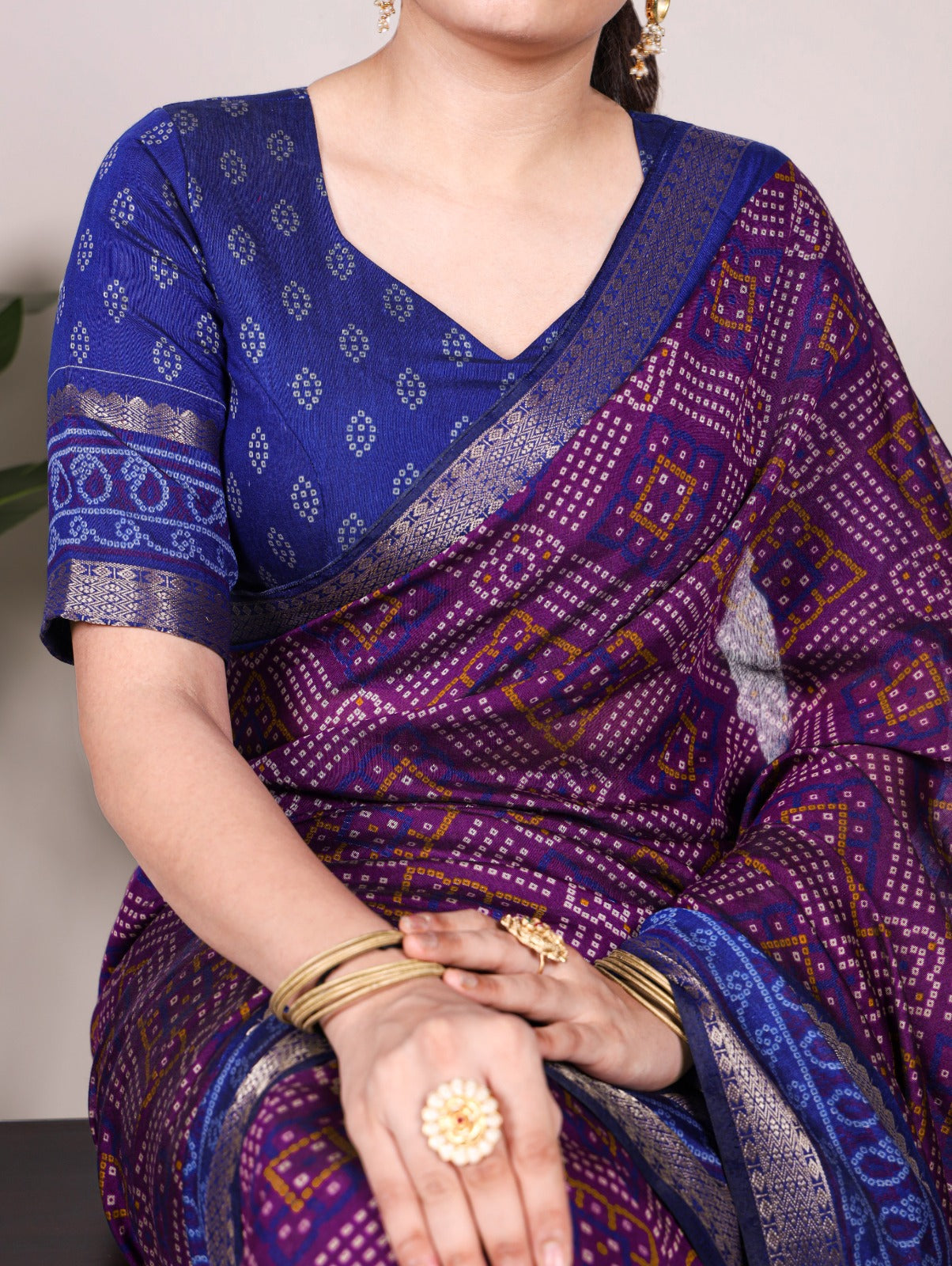 Feel the finesse of polyester viscose Chanderi, styled in Bandhej beauty